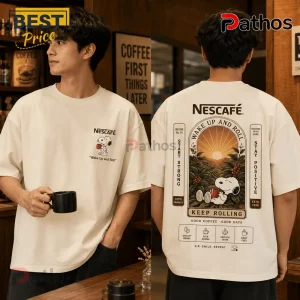 Off-white cotton t-shirt featuring Snoopy holding a red mug with Nescafe branding and Wake Up and Roll text graphics.!