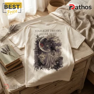 Off-white t-shirt with a back print of a woman sitting before a large moon, pillars, and flowers, text Starlight Dreams.!