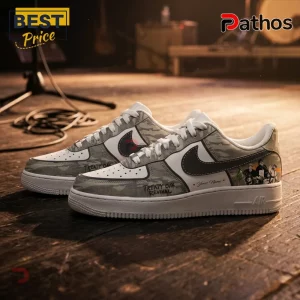 Custom camouflage low-top sneakers with Treaty Oak Revival branding and personalized name text on a wooden stage background.!