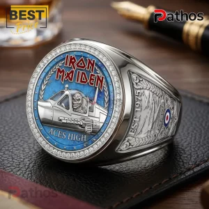 Silver Iron Maiden Aces High championship ring with blue inlay, Eddie pilot, and Est. 1975 engraving on a leather pad.!