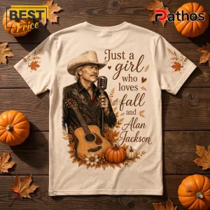 Alan Jackson Fall Pumpkin T-Shirt featuring a country singer with guitar on a cream shirt with leaves and text.