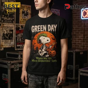 Green Day x Snoopy Halloween Black T-Shirt 4 Green Day x Snoopy Halloween Black T-Shirt featuring a cartoon skeleton Snoopy playing guitar against an orange moon.