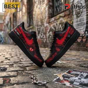 Shiva Live 2026 Black Red Custom Air Force 1 Sneakers 1 Black sneakers with red swoosh, Shiva and Milano Angels text, and heart graphics on a cobblestone urban street background.!