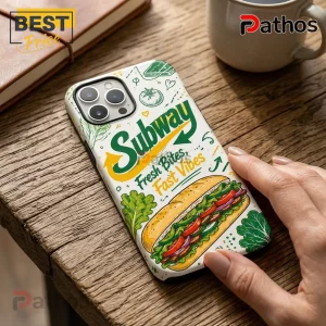 Subway branded iPhone case with green logo, sandwich illustration, and text reading Fresh Bites, Fast Vibes on wood desk.!