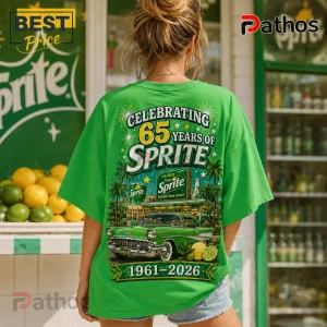 Woman wearing a green Sprite 65th anniversary t-shirt featuring a retro car, palm trees, and vintage soda shop graphic.!