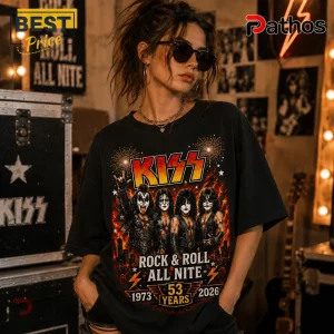 Black cotton t-shirt featuring KISS band members, fire graphics, and text reading Rock & Roll All Nite 1973-2026 53 Years.!