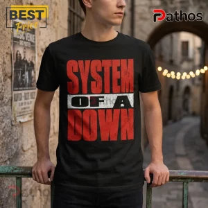 Black short-sleeve crewneck t-shirt featuring distressed red System of a Down text logo on a white horizontal bar.!