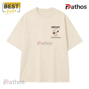 Nescafe x Snoopy Wake Up and Roll Cream T-Shirt 2 Beige cotton t-shirt with a small Nescafé logo and Snoopy graphic holding a coffee mug captioned Wake Up and Roll.!