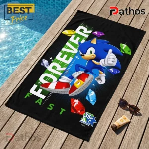 Sonic the Hedgehog 35th Anniversary Fast Forever Beach Towel 4 Sonic the Hedgehog beach towel with Forever Fast text, multicolored Chaos Emeralds, and 35th Anniversary Sega logo.!