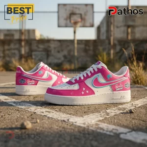 Barbie x Washington Mystics Pink Nike Air Force 1 Sneakers 2 Barbie x Washington Mystics Pink Nike Air Force 1 sneakers with white, pink, and teal branding on an outdoor basketball court.