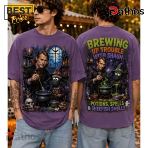 Mads Mikkelsen x Shaun The Sheep Purple Halloween T-Shirt 1 Mads Mikkelsen x Shaun The Sheep Purple Halloween T-Shirt featuring a potion brewing scene with a witch hat and cauldron.