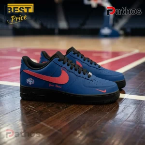 Custom blue and red Nike Air Force 1 sneakers with black soles and laces on a basketball court.!