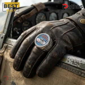 Iron Maiden Aces High silver ring with blue enamel, worn on a brown leather pilot glove inside a vintage airplane cockpit.!