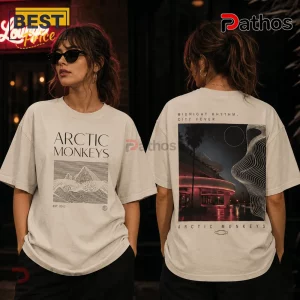 Arctic Monkeys graphic t-shirt in cream with front line art of mountains and back print of a neon city night scene.!