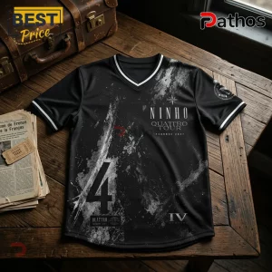 Black V-neck jersey with Ninho Quattro Tour graphic, silver paint splatter design, number 4, and white striped trim.!