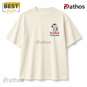 Off-white crewneck t-shirt featuring a small Peanuts Snoopy graphic with sunglasses and a Red Bull can on the left chest.!