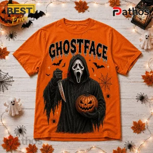 Ghostface Orange Halloween 2026 T-Shirt featuring a black-cloaked character holding a knife and jack-o'-lantern.