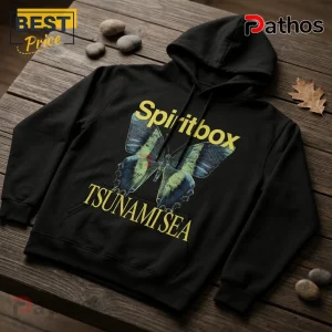 Spiritbox Tsunami Sea 2026 Vintage Black Hoodie 1 Black cotton hoodie featuring a yellow Spiritbox Tsunami Sea butterfly graphic on a wooden table with small stones.!