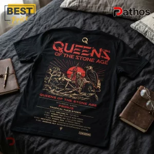 Queens of the Stone Age concert tour t-shirt in black with red and gold skeleton, desert, and vulture graphic print.!