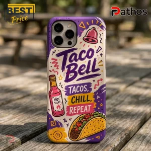 Taco Bell branded iPhone case with purple background, hot sauce bottle graphic, taco illustration, and text on wooden table.!