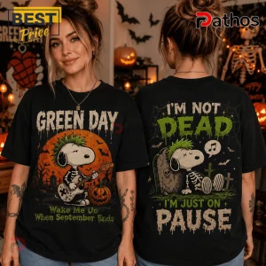 Green Day x Snoopy Halloween Black T-Shirt 3 Green Day x Snoopy Halloween Black T-Shirt with skeleton Snoopy graphics, text, and spooky cemetery background elements.