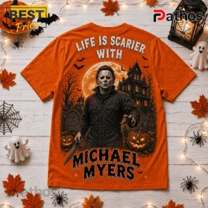 Michael Myers Halloween Orange T-Shirt 2026 2 Michael Myers Halloween Orange T-Shirt 2026 featuring a graphic of Michael Myers, a haunted house, and a full moon.