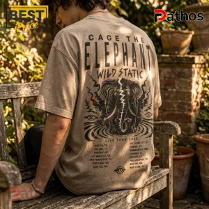 Sand-colored vintage wash t-shirt with black Cage The Elephant Wild Static graphic and 2025 tour dates on the back.!