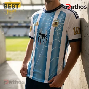 Messi x Spider-Man Argentina 2026 FIFA World Champion T-Shirt 2 Argentina national soccer jersey featuring white and blue stripes, spider web pattern, AFA logo, and number 10 on sleeve.!