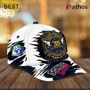 Sonic the Hedgehog 35th anniversary white baseball cap with blue graphic emblem, text reading 1991-2026 on wood table.!