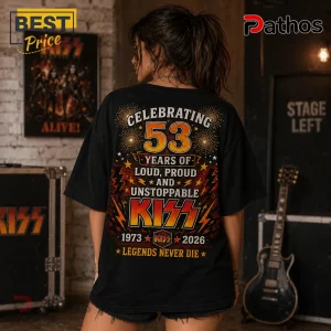 Black t-shirt featuring KISS band graphic with number 53, fireworks, lightning bolts, and text 1973-2026 on the back.!
