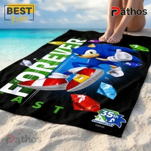 Sonic the Hedgehog 35th Anniversary Fast Forever Beach Towel 1 Sonic the Hedgehog beach towel with Chaos Emeralds and 35th Anniversary logo on black background at the beach.!