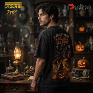 Man wearing black t-shirt with Darth Vader skull graphic and text A Fright From A Galaxy Far Away in a dark study room.!
