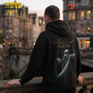 Black cotton hoodie featuring back print of Sam Smith and To Be Free text over a blurry European city background.!