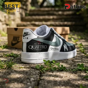 Custom Nike Air Force 1 sneaker featuring black, white, and sage green panels with Ninho Quattro Tour 2027 printed text.!