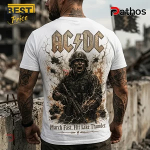 White t-shirt showing back print of an AC/DC soldier graphic, combat gear, helicopters, and text March Fast. Hit Like Thunder.!