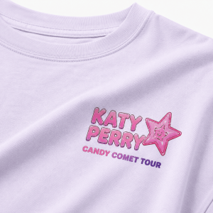 Katy Perry Candy Comet Tour 2026 Pink Shirt 1 Light purple cotton t-shirt with Katy Perry Candy Comet Tour logo and a pink star character graphic on the chest.!