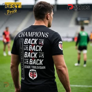 Man wearing a black Stade Toulousain rugby t-shirt featuring back-to-back Top 14 championship graphics on the back.!