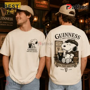 Cream-colored cotton t-shirt featuring Snoopy holding a Guinness pint glass on the chest and large back print graphic.!