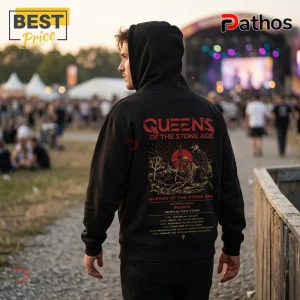 Queens of the Stone Age Desert Rock Australia Tour 2026 Hoodie 4 Man wearing black Queens of the Stone Age concert hoodie with skeleton and vulture graphic at an outdoor music festival.!