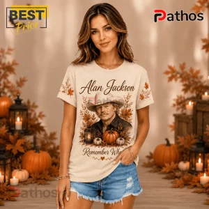Alan Jackson Fall Pumpkin T-Shirt featuring a portrait of the country singer, autumn leaves, and pumpkins on beige fabric.