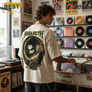 Megadeth Snoopy Countdown to Loud T-Shirt 4 Man wearing an off-white oversized t-shirt with a Megadeth graphic featuring Snoopy, a clock, and a robotic skull.!