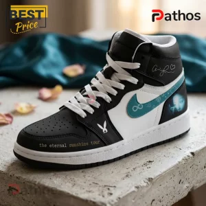 Ariana Grande Eternal Sunshine Tour Black Teal Air Jordan 1 1 Ariana Grande Eternal Sunshine Tour Black Teal Air Jordan 1 sneaker with white laces and themed heel graphic.