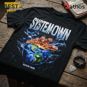 Black cotton t-shirt featuring Systemown text, a hand crushing the Earth, blue lightning, and EU/UK 2026 print.!