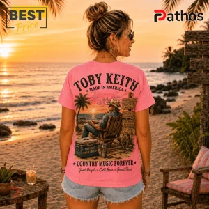 Pink cotton t-shirt featuring a Toby Keith graphic, a cowboy sitting on a beach chair, and country song lyric signs.!