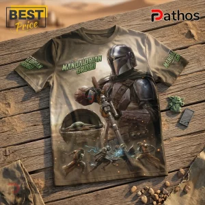 Tan crew neck t-shirt featuring The Mandalorian and Grogu graphic print on a desert background with Star Wars text.!