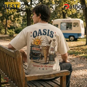 Oasis Ice Cream Day Cream T-Shirt 2026 4 Cream-colored t-shirt featuring an Oasis band graphic with an ice cream cone, a sun, and the text Scoops for the soul.!