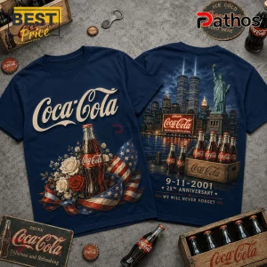 Coca Cola 9-11 25th Anniversary T-Shirt 2 Coca Cola 9-11 25th Anniversary T-Shirt in navy blue featuring a graphic of NYC skyline, Statue of Liberty, and bottles.