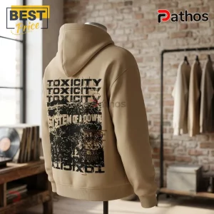System of a Down Australia Tour 2027 Tan Hoodie 1 System of a Down Australia Tour 2027 tan hoodie displaying Toxicity text and distressed black graphic on the back.