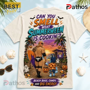 The Rock x Bluey Summerween Beige T-Shirt featuring a cartoon graphic of The Rock and Bluey on a beach at sunset.