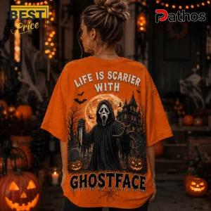Ghostface Orange Halloween 2026 T-Shirt featuring a horror villain graphic, spooky house, full moon, and jack-o-lanterns.